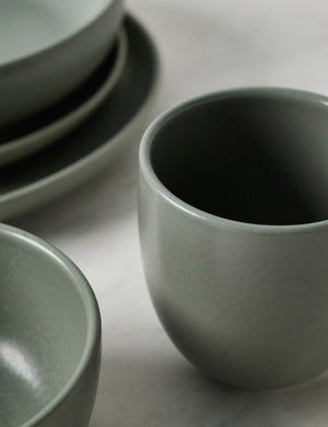 Close-up of the mug in the Pacifica artichoke green Dinnerware 5-Piece Place Setting by Casafina