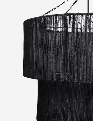 Close-up of the right side of the Chavette three-tiered black jute-wrapped chandelier
