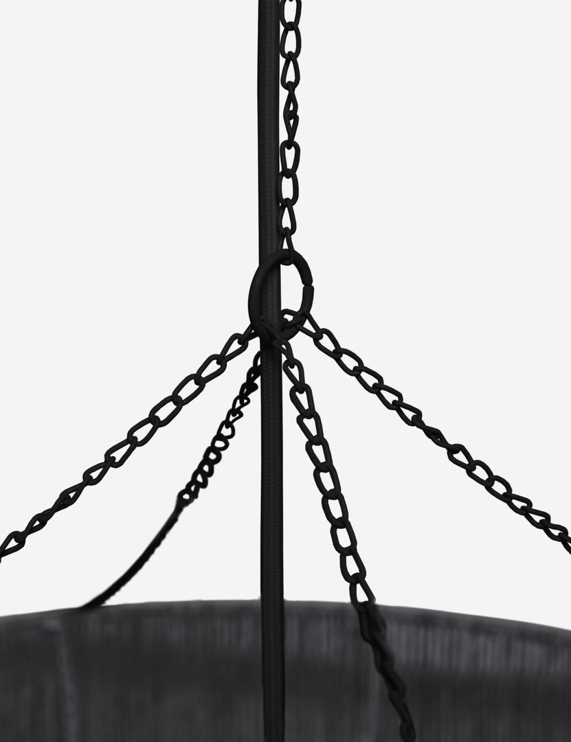 | Close-up of the chained hanging attachment on the Chavette three-tiered black jute-wrapped chandelier