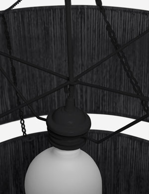 Close-up of the light fixture on the Chavette three-tiered black jute-wrapped chandelier
