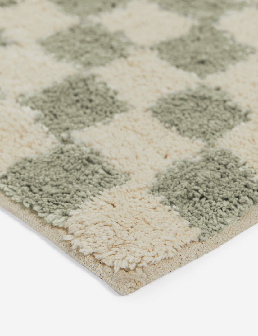 #color::lichen #size::21--x-34- #size::2--x-5- | Close up corner view of the Two-tone checkerboard bath mat by Sarah Sherman in lichen green