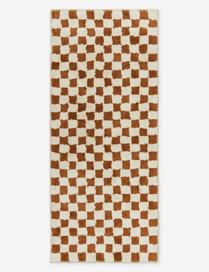 Two-tone long checkerboard bath mat by Sarah Sherman in rust umber