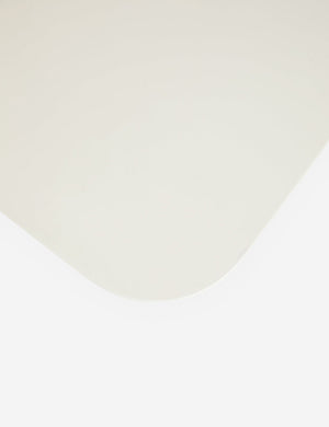 The rounded corner on the Clouded square white coffee table