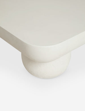 The rounded corner and leg on the Clouded square white coffee table