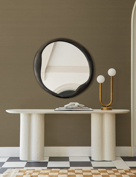 #color::olive | The Grasscloth olive green Solid Wallpaper is in a room with a black round mirror, checkerboard floors, and a white side table