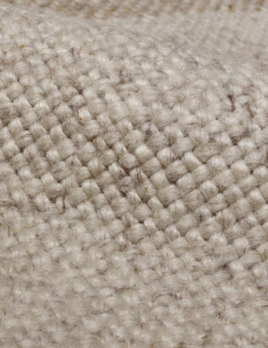 Close up of the Croze handwoven striped fringed outdoor rug.