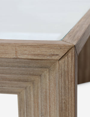 Close up view of the Pender modern wood and glass top square coffee table.