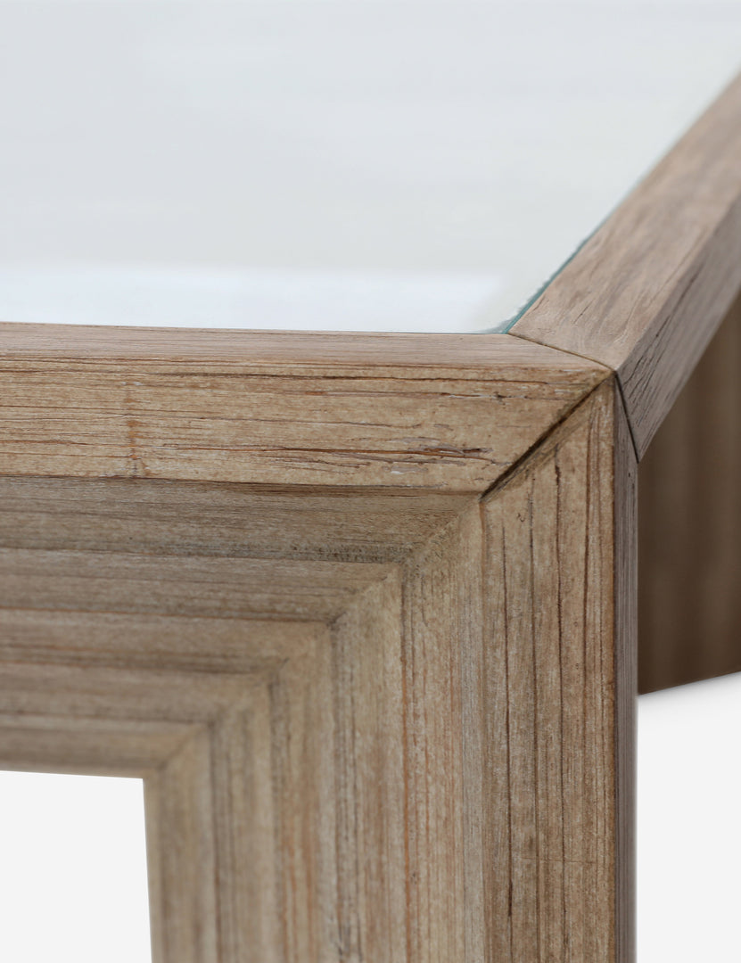 #color::natural | Close up view of the Pender modern wood and glass top square coffee table.