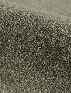 Close up of the Damara solid viscose rug in sage.