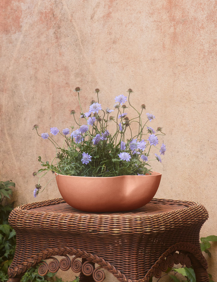 #color::sienna #style::small | Dempsy low sculptural small planter by Sarah Sherman Samuel in Sienna filled with flowers.