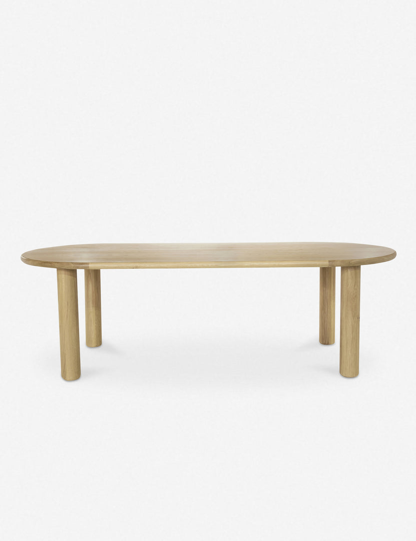 #color::natural | Side profile of the Dever oak wood oval dining table.