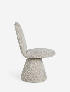 Side profile of the Fenton textured sculptural upholstered minimalist dining chair.
