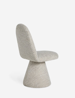 Angled back view of the Fenton textured sculptural upholstered minimalist dining chair.