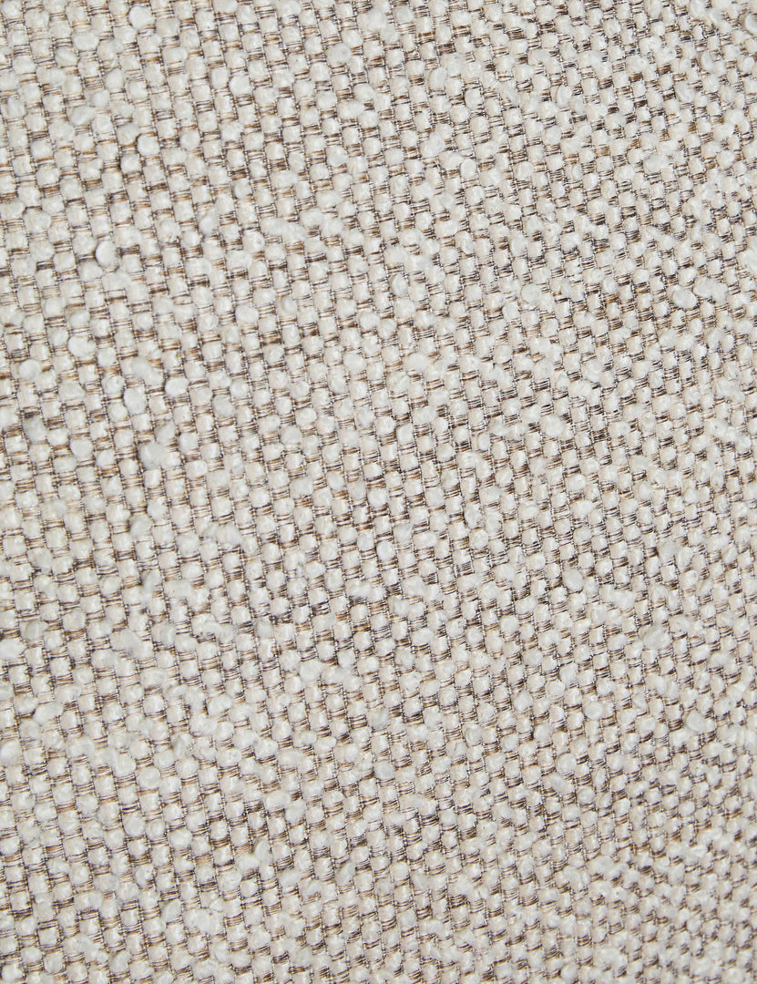 #color::natural-basketweave | Close up of the Fenton textured sculptural upholstered minimalist dining chair.