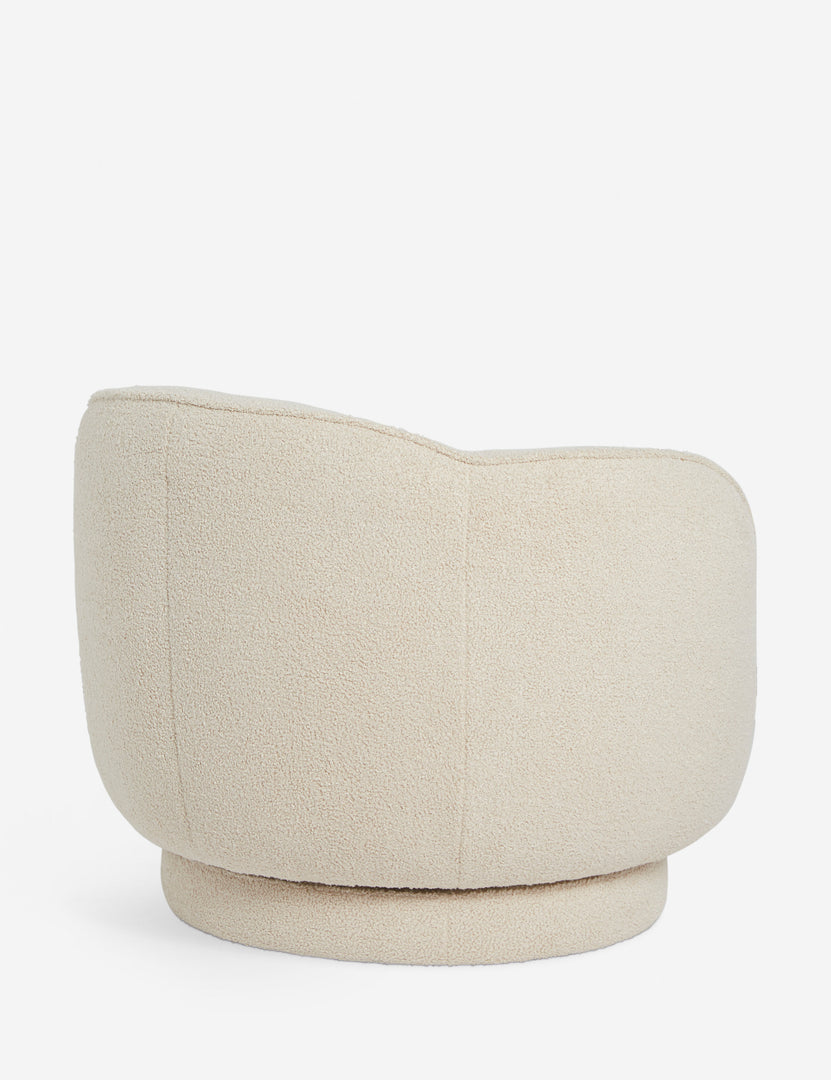 | Side view of the Fern scalloped back boucle upholstered swivel chair