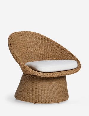 Angled view of the Ferran sculptural wicker outdoor accent chair.