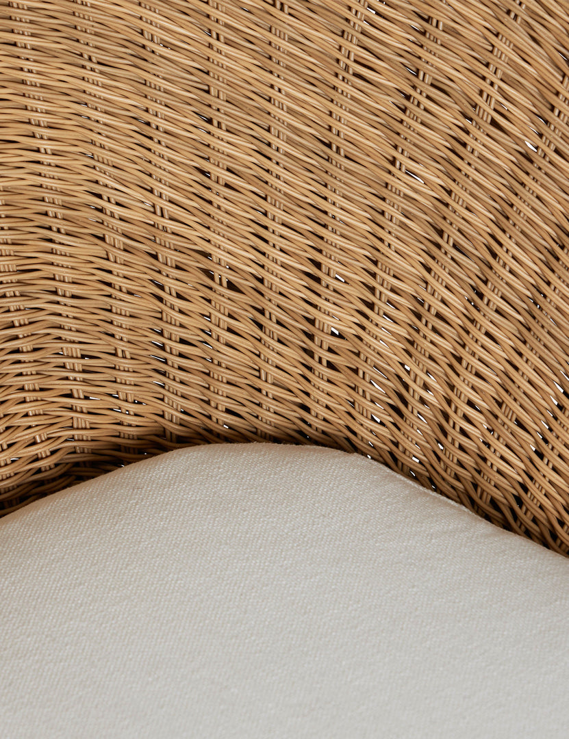 #color::natural | Close up of the Ferran sculptural wicker outdoor accent chair.