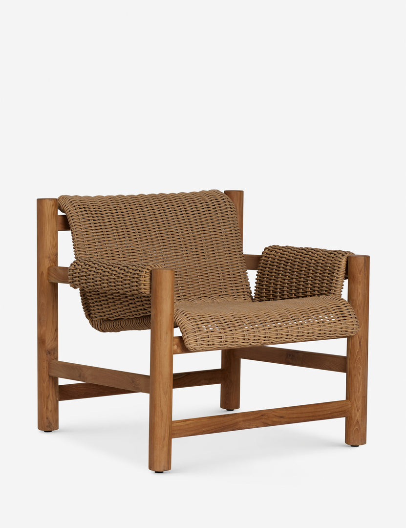 #color::natural | Angled view of the Gally wicker and teak outdoor accent chair.