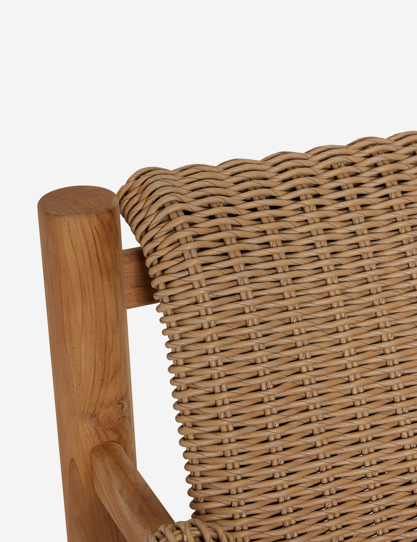#color::natural | Close up of the Gally wicker and teak outdoor accent chair.