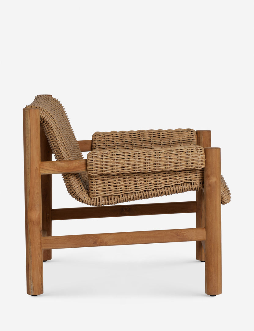 #color::natural | Side profile of the Gally wicker and teak outdoor accent chair.
