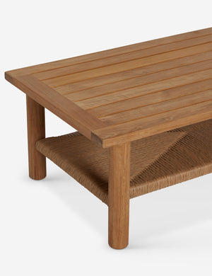 Angled overhead view of the Gally teak and wicker outdoor coffee table.