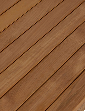 Close up of the slatted top of the Gally teak and wicker outdoor coffee table.