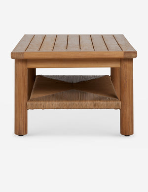 Side profile of the Gally teak and wicker outdoor coffee table.