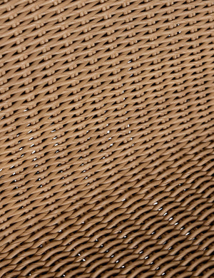 Close up of the wicker seat of the Gally wicker and teak outdoor dining chair.