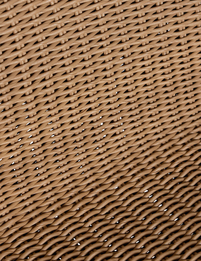 #color::natural | Close up of the wicker seat of the Gally wicker and teak outdoor dining chair.