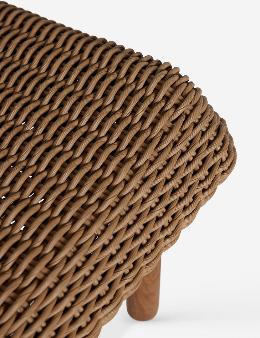 #color::natural | Close up of the Gally wicker and teak outdoor dining chair.