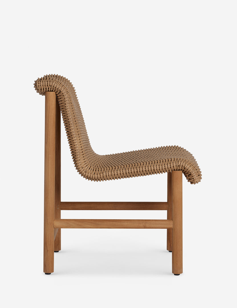 #color::natural | Side profile of the Gally wicker and teak outdoor dining chair.