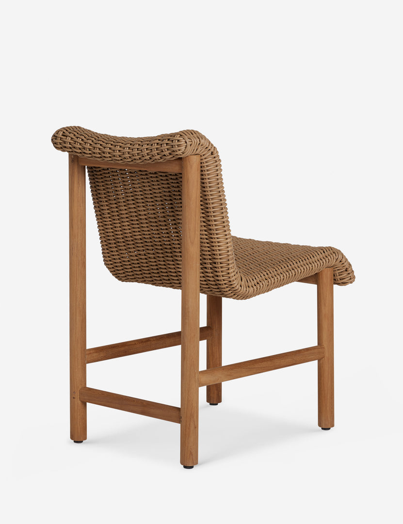 #color::natural | Angled back view of the Gally wicker and teak outdoor dining chair.