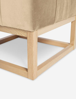 Close up of the airy wooden frame on the bottom of the Grasmere Brie Velvet Ottoman