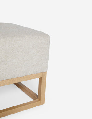 Close up of the airy wooden frame on the bottom of the Grasmere Taupe Boucle Ottoman