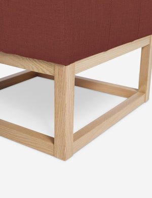 Close up of the airy wooden frame on the bottom of the Grasmere Terracotta Linen Ottoman