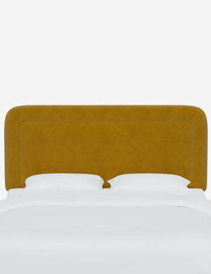 Gwendolyn Citronella Yellow Velvet headboard with soft, arched corners and an interior welt border
