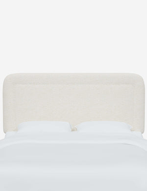 Gwendolyn Cream Sherpa headboard with soft, arched corners and an interior welt border