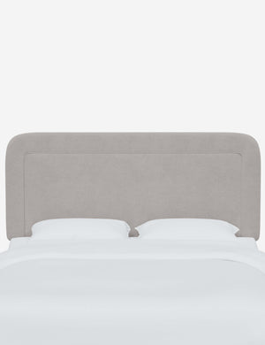 Gwendolyn Mineral Gray Velvet headboard with soft, arched corners and an interior welt border