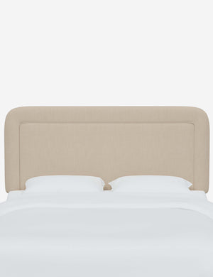 Gwendolyn natural linen headboard with soft, arched corners and an interior welt border