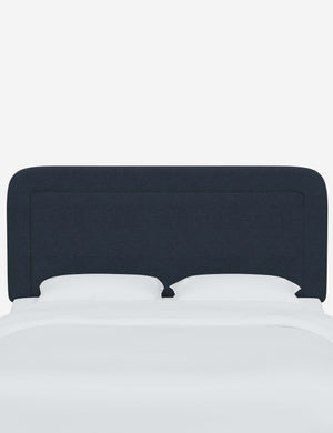 Gwendolyn Navy Linen headboard with soft, arched corners and an interior welt border