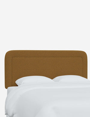 Gwendolyn Ochre Boucle headboard with soft, arched corners and an interior welt border