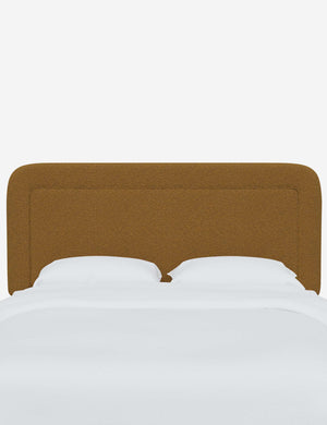 Gwendolyn Ochre Boucle headboard with soft, arched corners and an interior welt border