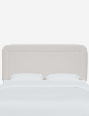 Gwendolyn Snow White Velvet headboard with soft, arched corners and an interior welt border