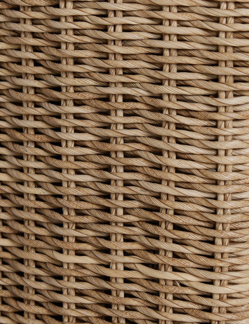#color::natural | Close up of the Hadler modern sculptural open frame wicker outdoor accent chair.
