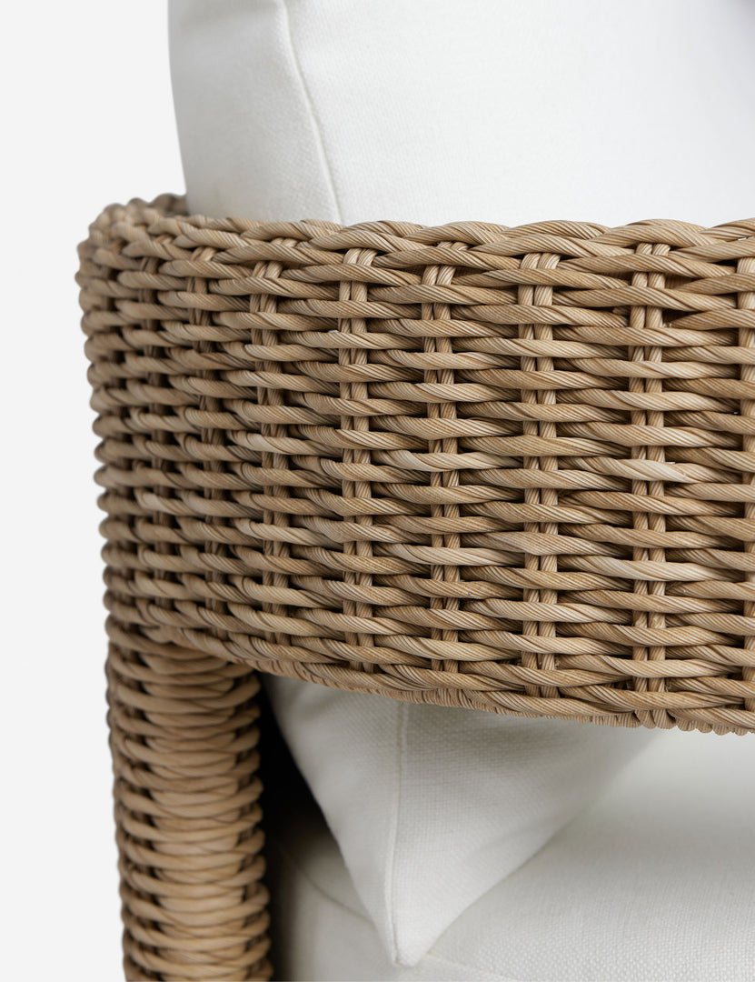 #color::natural | Close up of the Hadler modern sculptural open frame wicker outdoor sofa.