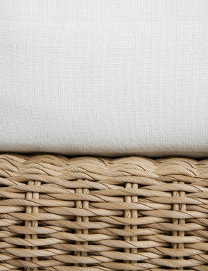 Close up of the seat cushion of the Hadler modern sculptural open frame wicker outdoor sofa.