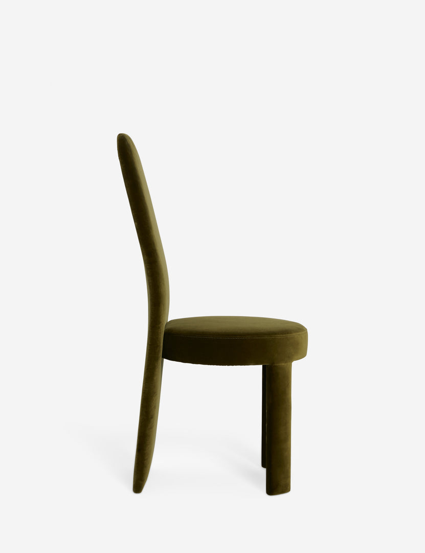 #color::green-velvet | Side view of the Halbrook upholstered tall back sculptural dining chair in green velvet