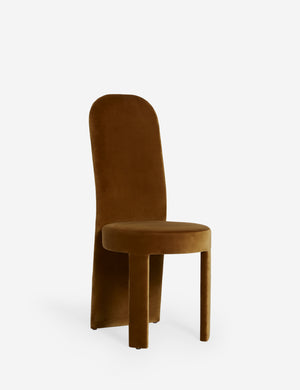 Angled view of the Halbrook upholstered tall back sculptural dining chair in sienna velvet