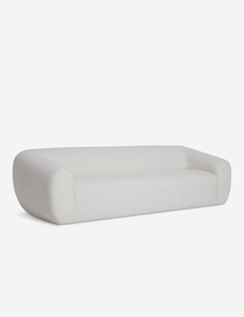 | Angled view of the Harlowe softly sculpted modern ivory sofa.