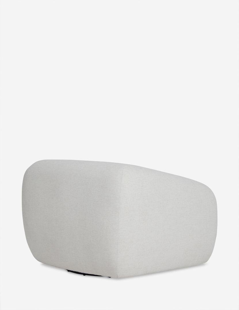 | Angled rear view of the Harlowe softly sculpted plush swivel accent chair.